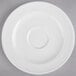 A white porcelain saucer with a circular rim.