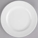 A close up of a Reserve by Libbey Royal Rideau white porcelain plate with a thin rim.