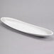 A white oval-shaped porcelain tray.