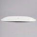 A white porcelain oval tray with a rectangular shape and a logo on the back.
