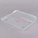 A white box containing 3 clear plastic Edlund scale covers with holes and red text.