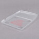 A clear plastic Edlund scale cover with red writing.
