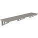 A long metal slotted wall shelf by Advance Tabco.