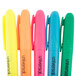 A set of Universal chisel tip highlighters in yellow, blue, green, and pink.
