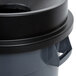 A gray and black round trash can with a black funnel top lid.