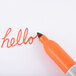 The word "hello" written in orange with a Sharpie marker.