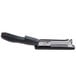 A Bostitch black ergonomic desktop stapler with a black handle.