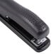 A close up of a black Bostitch ergonomic desktop stapler.