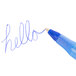 A close-up of a Bic blue medium point pen writing "hello" in blue ink.