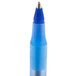 A close up of a Bic blue pen tip with a metal cone.