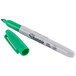 A close-up of a green Sharpie Fine Point Permanent Marker with a green cap.