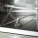 A Noble Warewashing II double rack low temperature corner dishwasher with a metal handle.