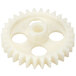 A white plastic gear with holes.