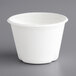An EcoChoice bagasse portion cup with a white lid.