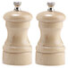 A Chef Specialties natural maple pepper mill and salt mill set with metal caps.