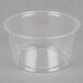 A clear plastic Fabri-Kal Greenware souffle container with a lid.