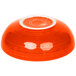 A orange Fiesta china bowl with a white rim.