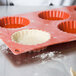 A red Matfer Bourgeat silicone fluted tart mold with 6 compartments.