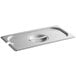 A Vigor stainless steel slotted hotel pan cover on a white tray.