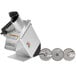 A silver Hobart continuous feed food processor with three circular discs.