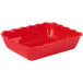 A red rectangular deli crock with a ruffled edge.