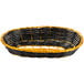 A close up of a black and yellow Thunder Group rattan cracker basket.