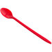 A red plastic soda spoon with a handle.