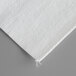 White envelope style filter paper with a small hole in it.