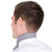 The back of a man wearing a houndstooth patterned Intedge chef neckerchief.