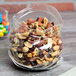 An American Metalcraft glass zipper bag filled with nuts and candy.