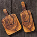 An American Metalcraft faux olive wood melamine serving peel with a wooden handle on a wood surface.