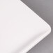 An American Metalcraft trapezoid melamine serving platter with a white surface and rim.