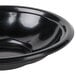 A black Genpak foam utility bowl with a rim.