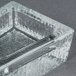 A Libbey glass square ashtray with a textured surface.