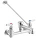 A silver T&S mop sink faucet with two long handles.