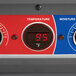 A close up of the temperature control panel for a Metro C5 1 Series proofing cabinet with a red and blue digital temperature display.