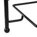 An American Metalcraft Ironworks black metal three-tier display stand with round ball legs.