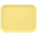 A yellow Cambro tray with a white border.