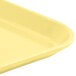 A yellow Cambro cafeteria tray with a handle.