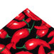 A black fabric with red chili pepper pattern.