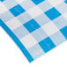A blue and white checkered paper table cover with a blue and white checkered pattern.