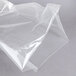 A clear plastic bag of ARY VacMaster chamber vacuum packaging bags on a gray surface.