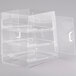 A clear acrylic display case with three shelves and front and rear doors.