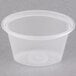 A clear plastic Newspring oval souffle container with a lid.