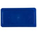 A blue rectangular plastic lid with a small hole in it.