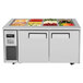A Turbo Air refrigerated buffet display table with food trays.