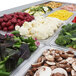 A tray of vegetables in a Turbo Air refrigerated buffet display table.
