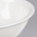 A close-up of a CAC Garden State white porcelain bowl with a rim.