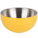 A yellow Vollrath beehive serving bowl with silver stainless steel accents.