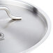 A close-up of a Vollrath stainless steel pan lid with a handle.